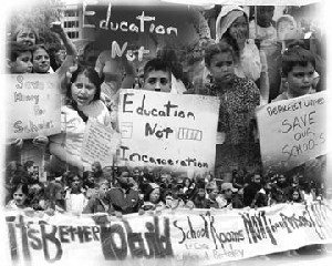 Photos of children holding signs at the May 8 rally, with slogans like 'Save our Schools' and 'Education Not Incarceration'
